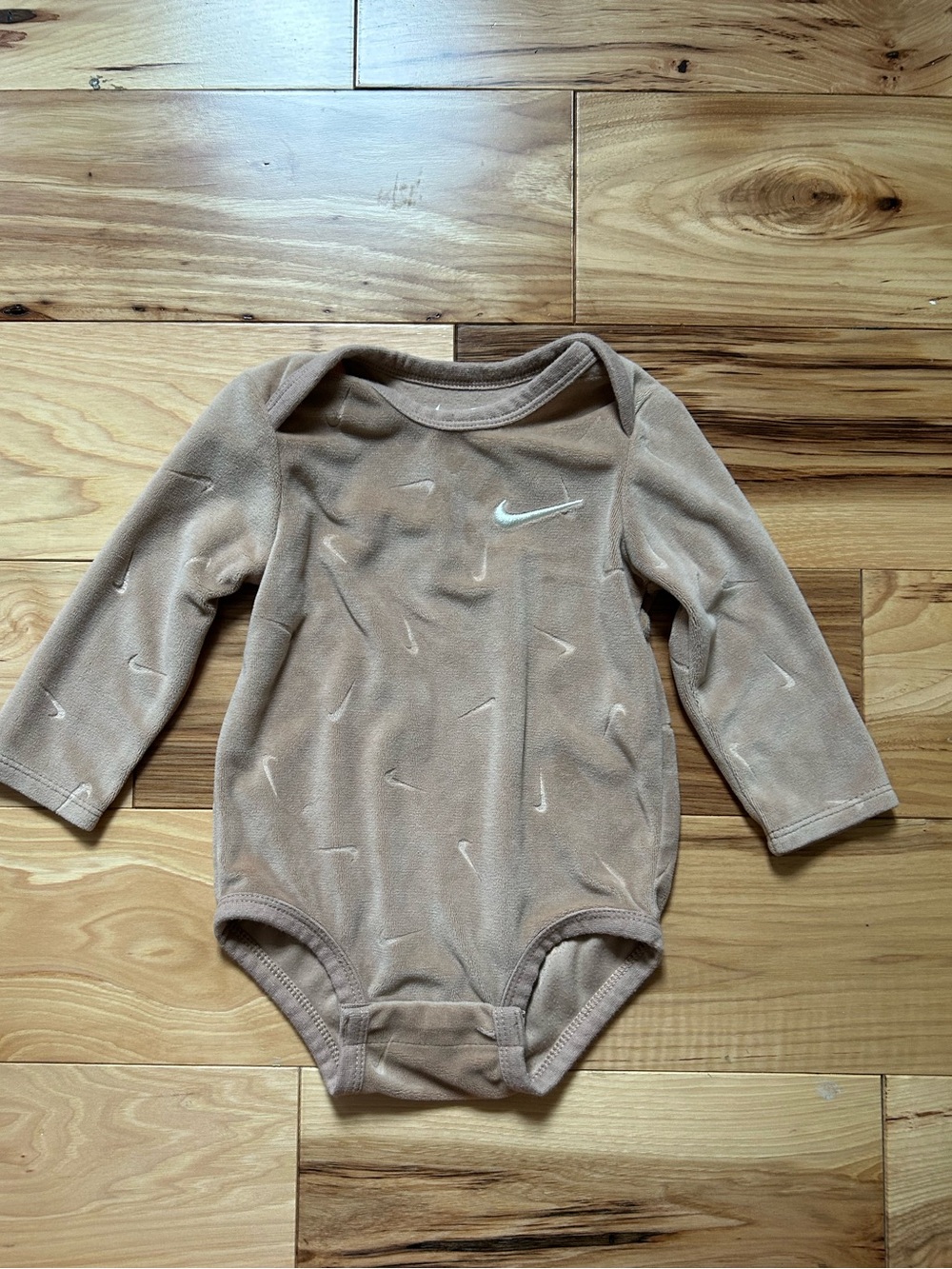 Nike Beige Long-Sleeve Baby Bodysuit with White Swoosh Accents